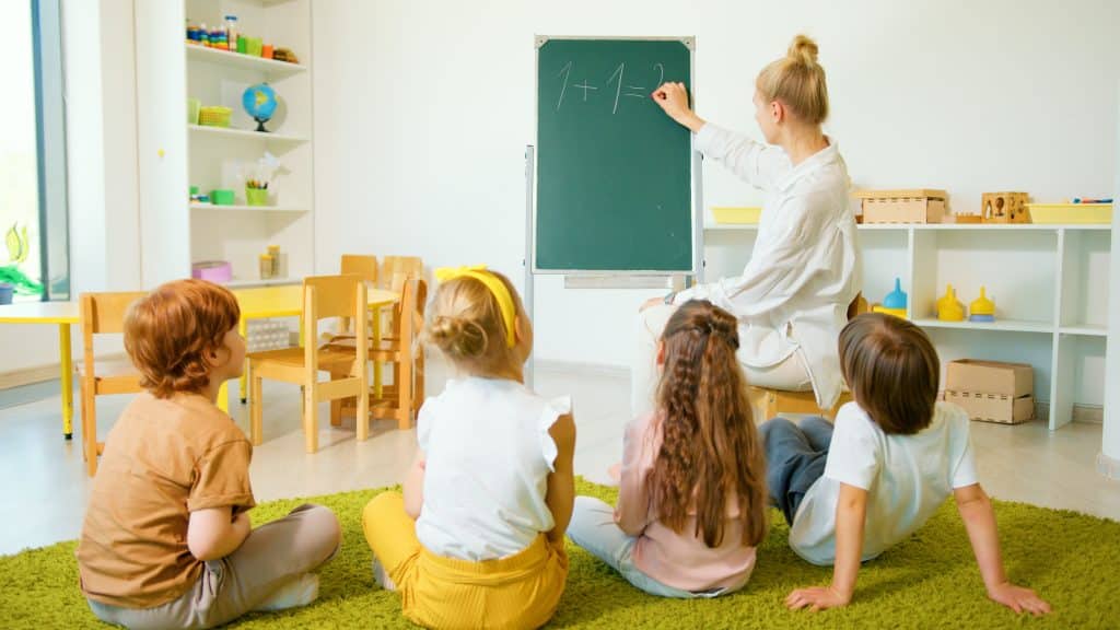 Help kids with adhd learn math this image shows children learning math in a classroom