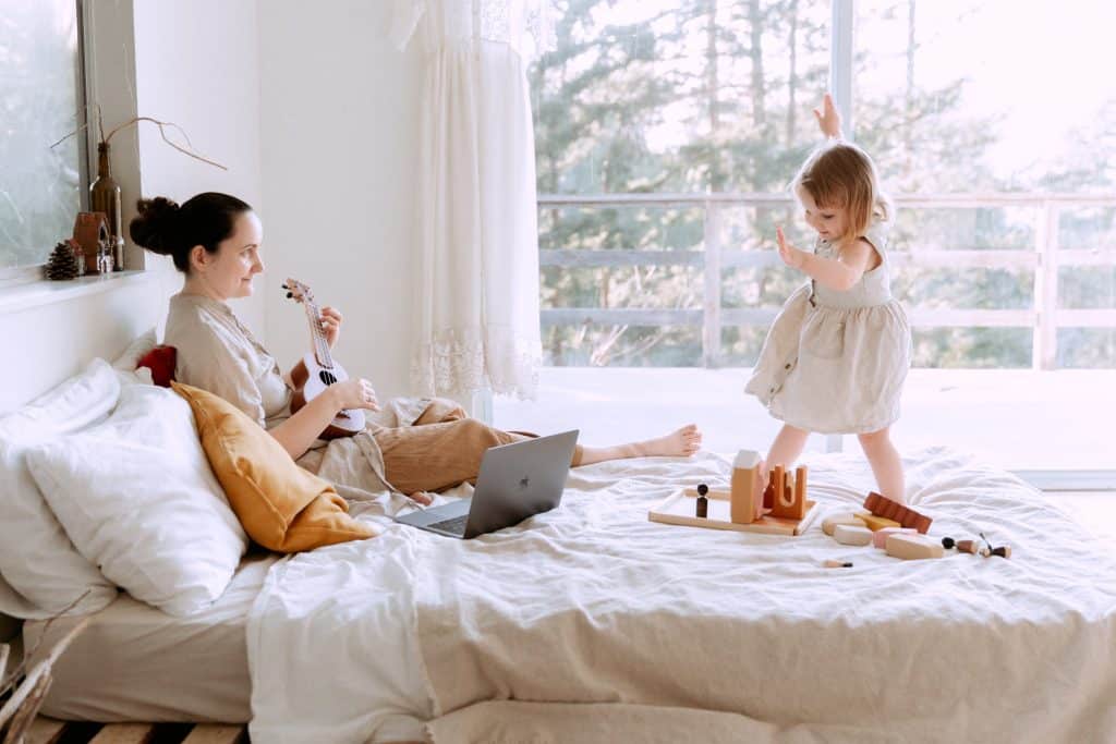 token board template. a mother sits on the bed with her daughter.