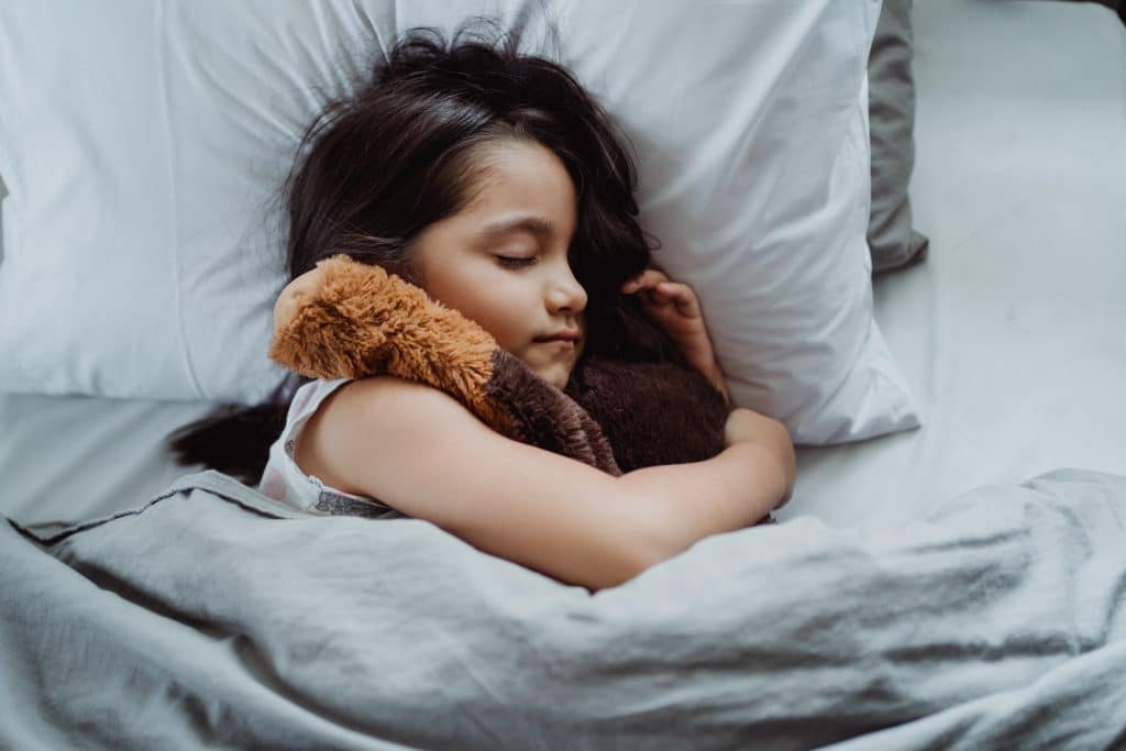 Weighted blanket autism this image shows a girl sleeping