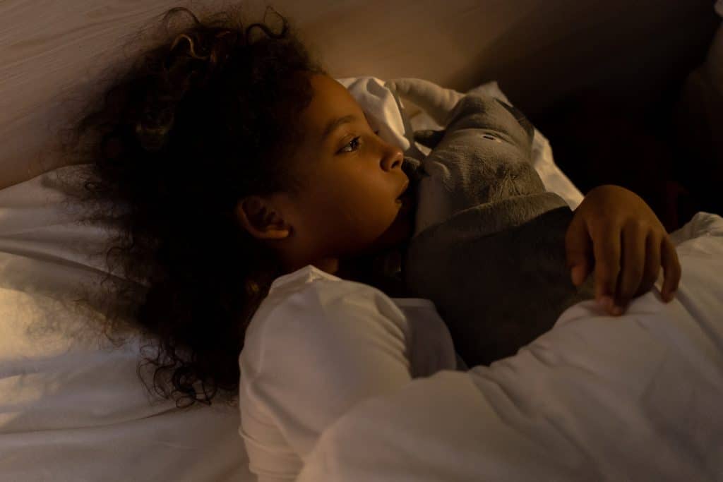 adhd meltdowns at bedtime this image shows a little girl alone in bed