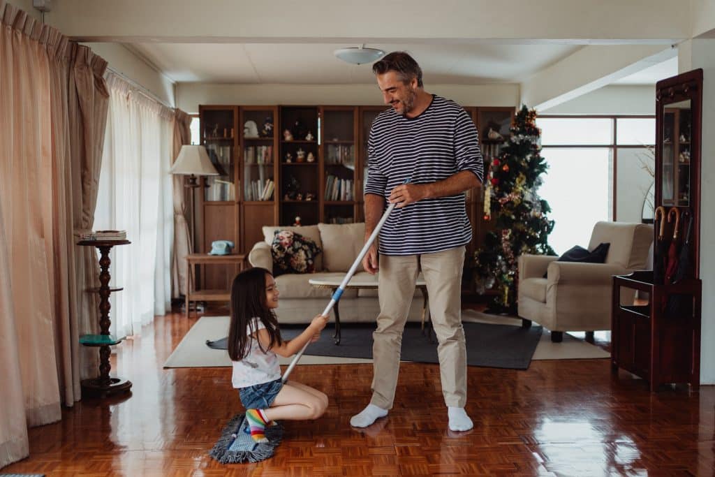 prompt hierarchy ABA this image shows a father and daughter cleaning the house