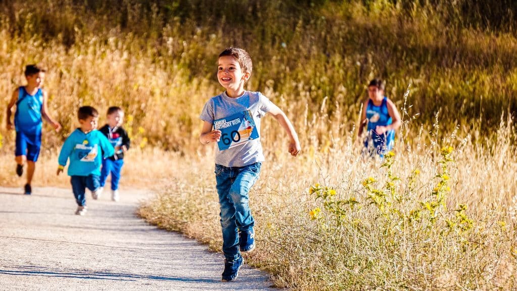 causes of ADHD. A child is running to get energy out due to ADHD.