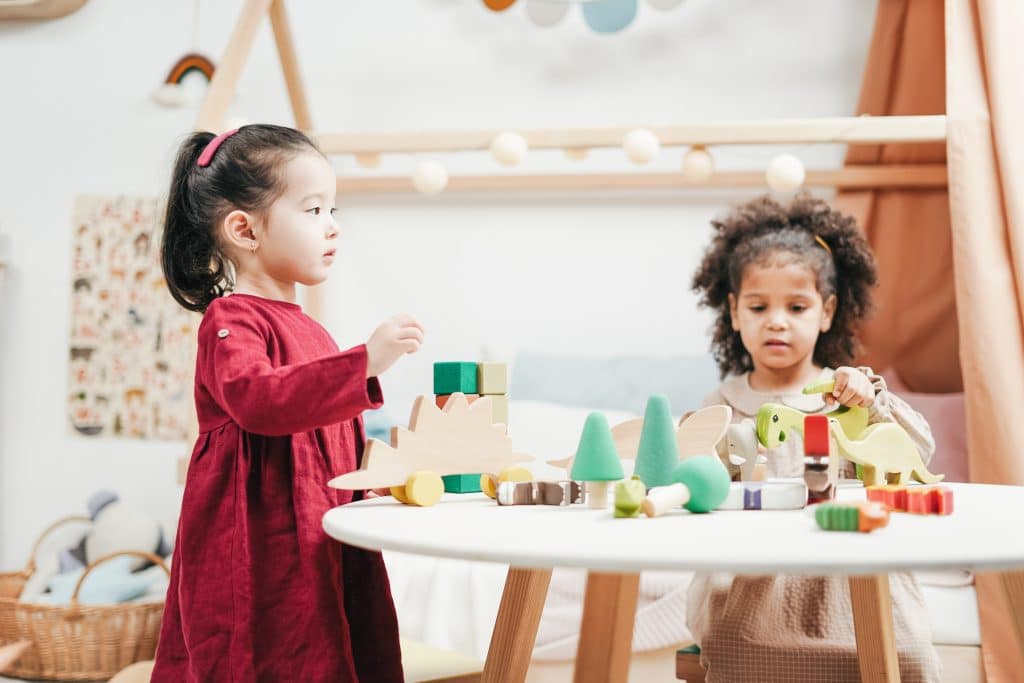 is adhd a neurodevelopmental disorder. Children play together, one with adhd.