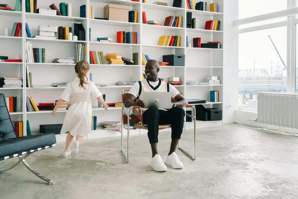 How to tell if your kid is autistic can be a journey as seen here with a father who is observing his kid running around.