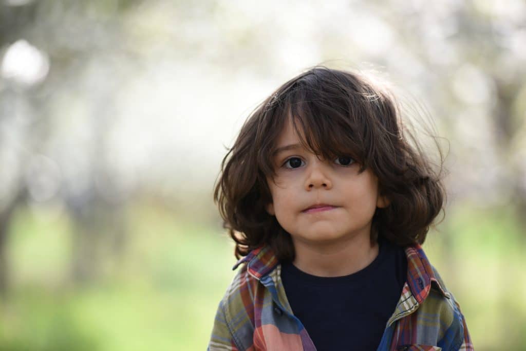 can autism go away with age. a kid is smiling.