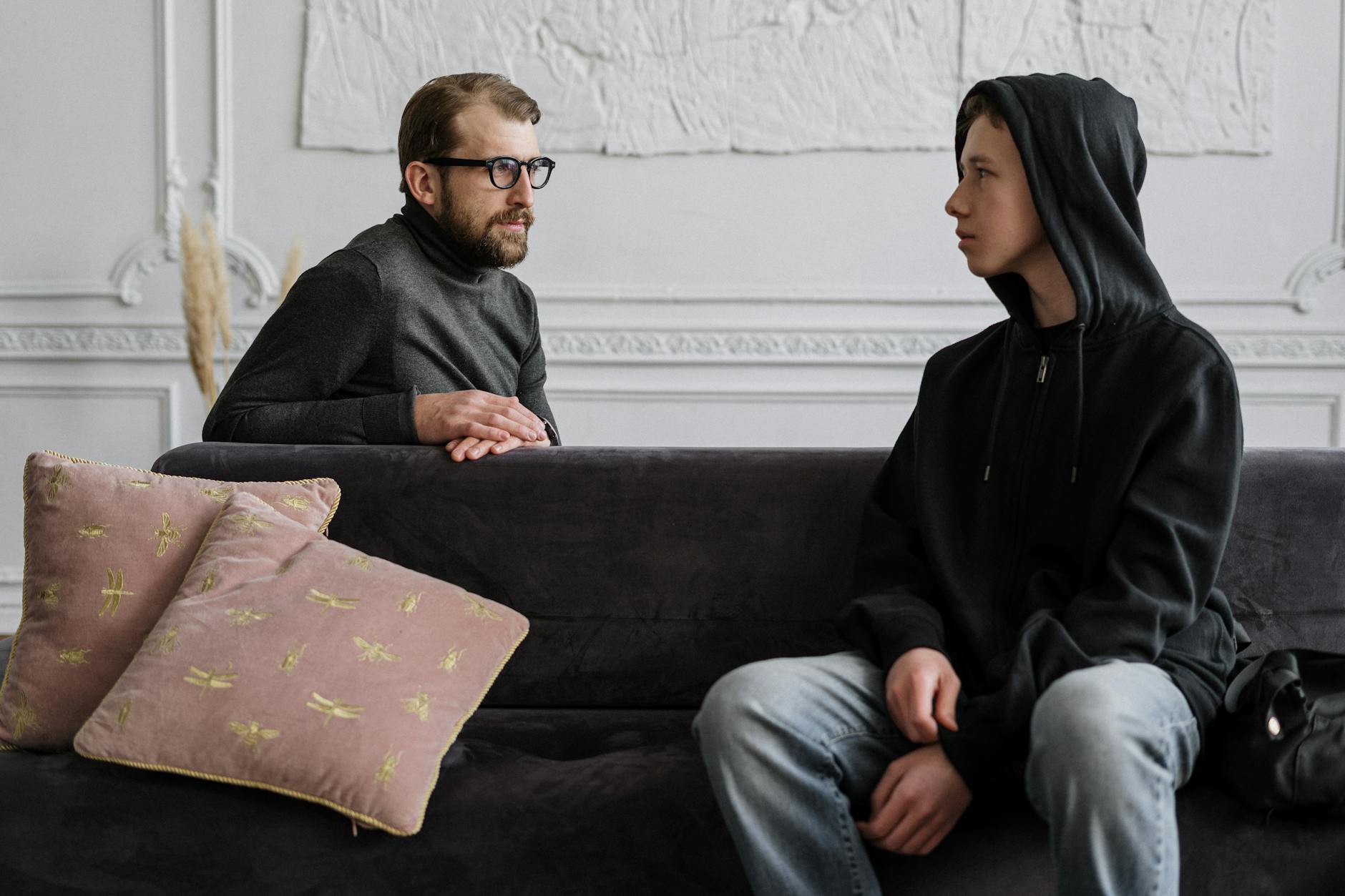autistic disorder icd 10 man in black jacket sitting on couch