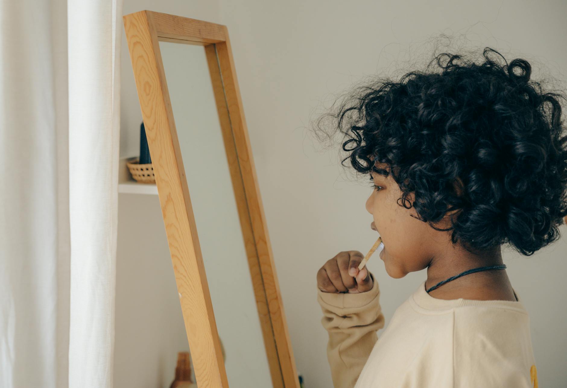 how to not take things personally ethnic kid brushing teeth opposite mirror